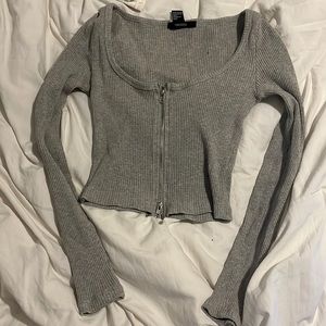 grey cropped long sleeve with zippers at top and bottom
